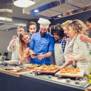 people taking a cooking class with a chef