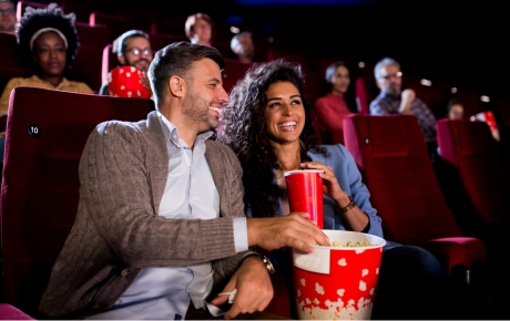couple at the cinema eating popcorn