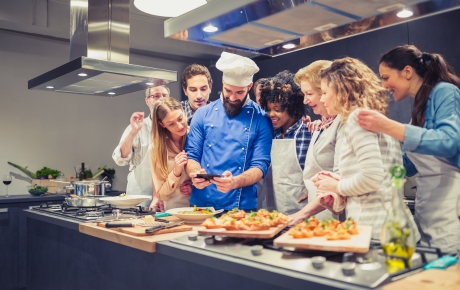 people taking a cooking class with a chef
